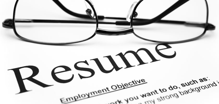 Eye glasses on top of a resume
